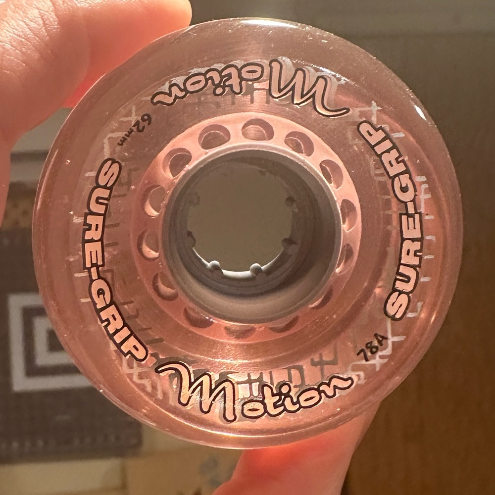 Sure Grip clear pink Motion Wheels 78A wheels + Bones bearings for roller skates
